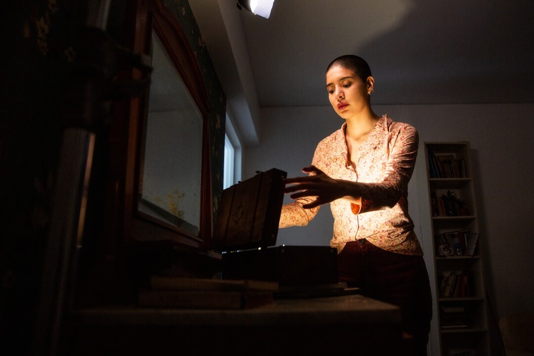 mystery writer typing in dim light